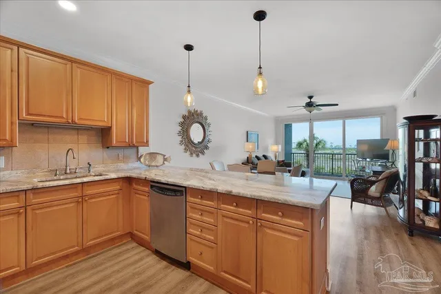 a kitchen with sink stove and cabinets