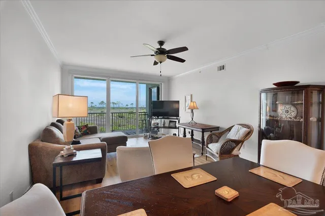 a living room with furniture rug and window