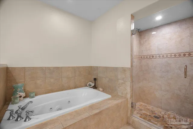 a bathroom with a bathtub and shower