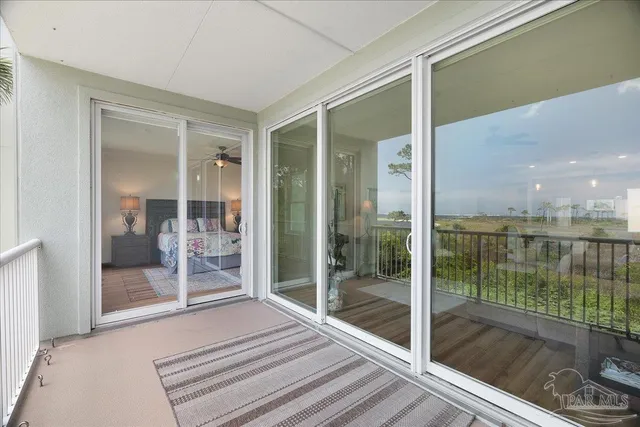 a room with sliding glass door and glass door