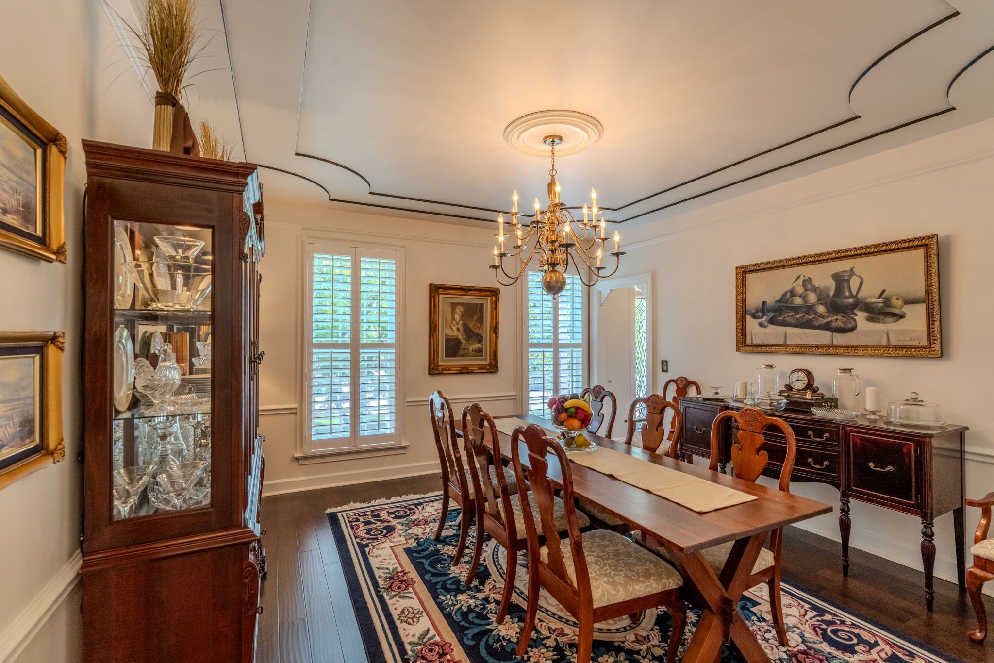 404 Chesterfield Place Franklin, TN 37064 - Photo 9 of 38 a view of a dining room with furniture a chandelier and wooden floor