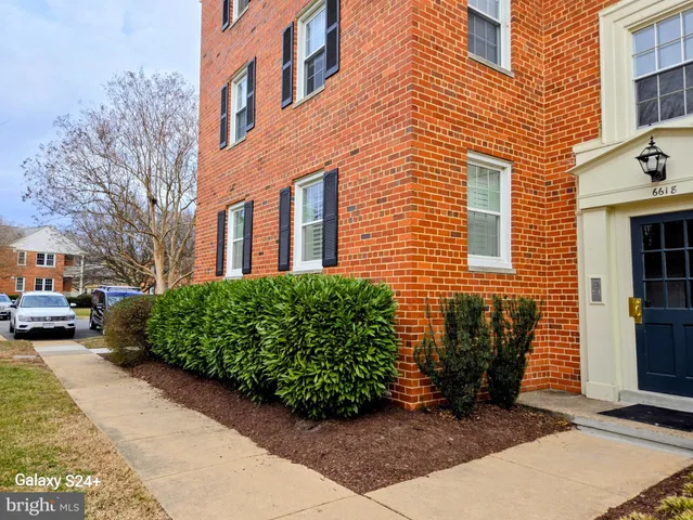 a view of a street with benches