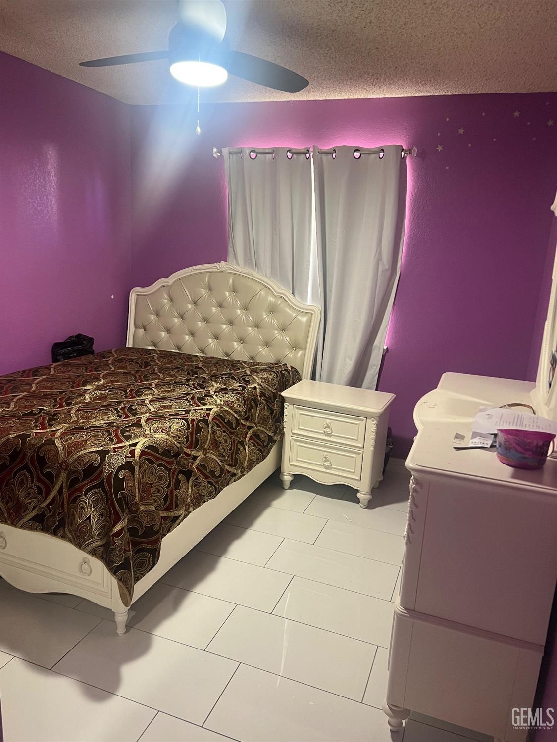 Undisclosed Address Delano, CA 93215 - Photo 4 of 8 a bedroom with a bed and a mirror