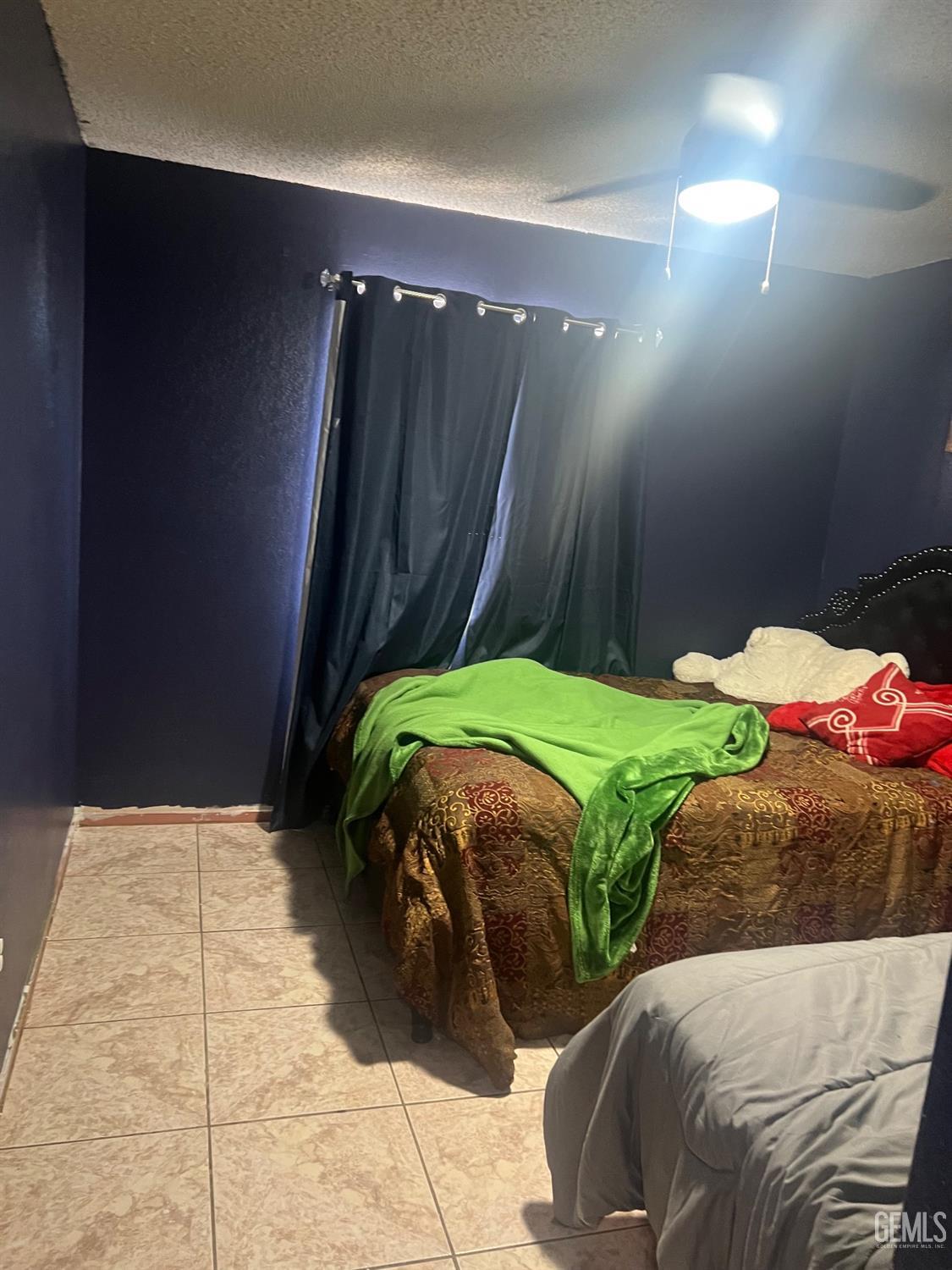 Undisclosed Address Delano, CA 93215 - Photo 6 of 8 a bedroom with two bed and a shower