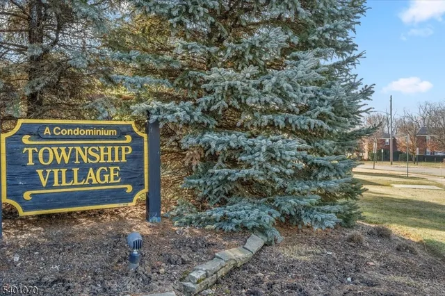 a sign that is sitting on a rock