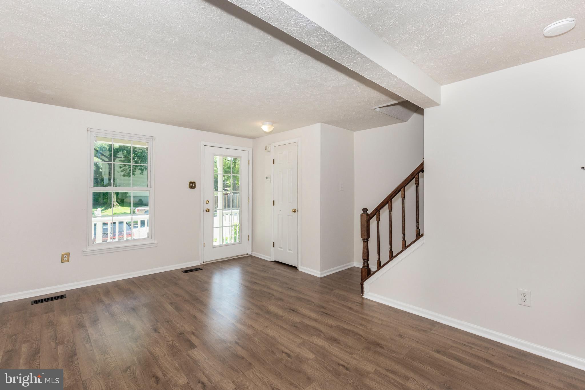 4903 Clifford Road Perry Hall, MD 21128 - Photo 3 of 30 an empty room with wooden floor and windows