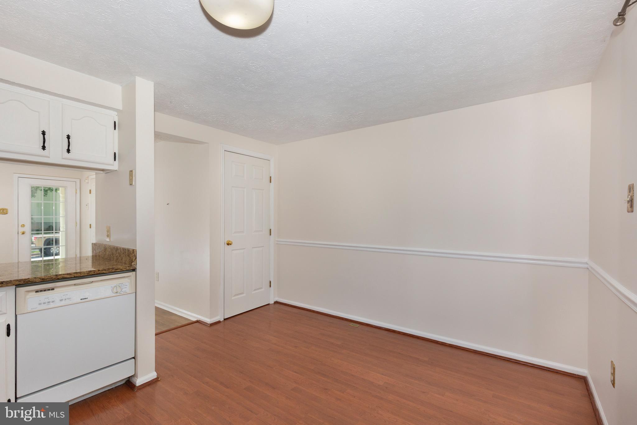 4903 Clifford Road Perry Hall, MD 21128 - Photo 10 of 30 a room with a wooden floor and white walls