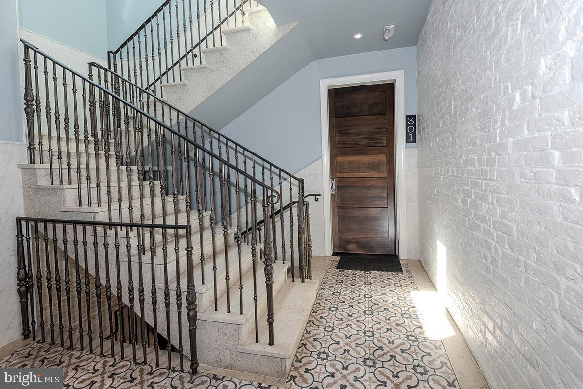 418 7th Street Southeast, Unit 302 Washington, DC 20003 - Photo 5 of 35 This stunning staircase leads to your condo.