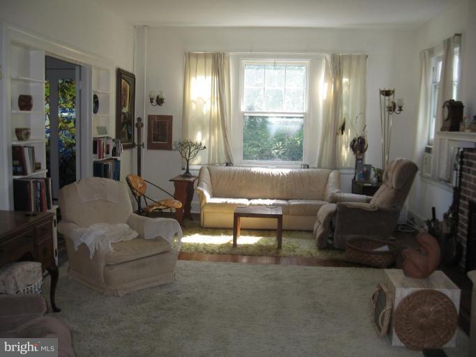 3946 Cloverhill Road Baltimore, MD 21218 - Photo 2 of 19 a living room with furniture and a large window