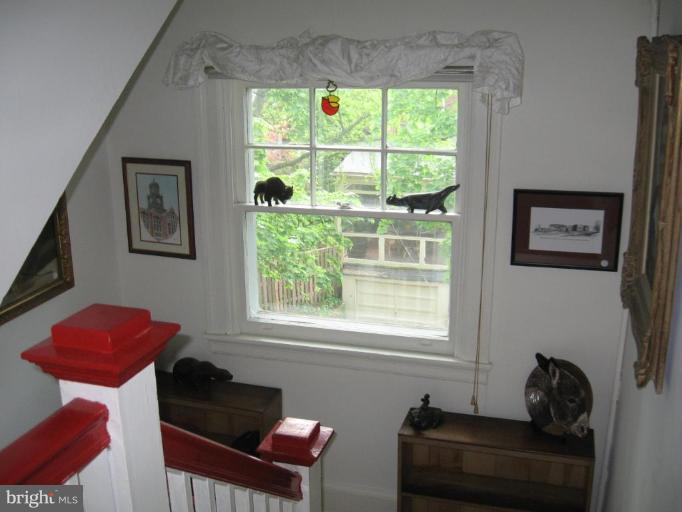 3946 Cloverhill Road Baltimore, MD 21218 - Photo 14 of 19 a living room with furniture and a window