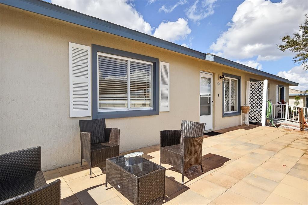622 Ridge Terrace Winter Haven, FL 33881 - Photo 25 of 29 a outdoor space with patio the couches and a potted plant on the table