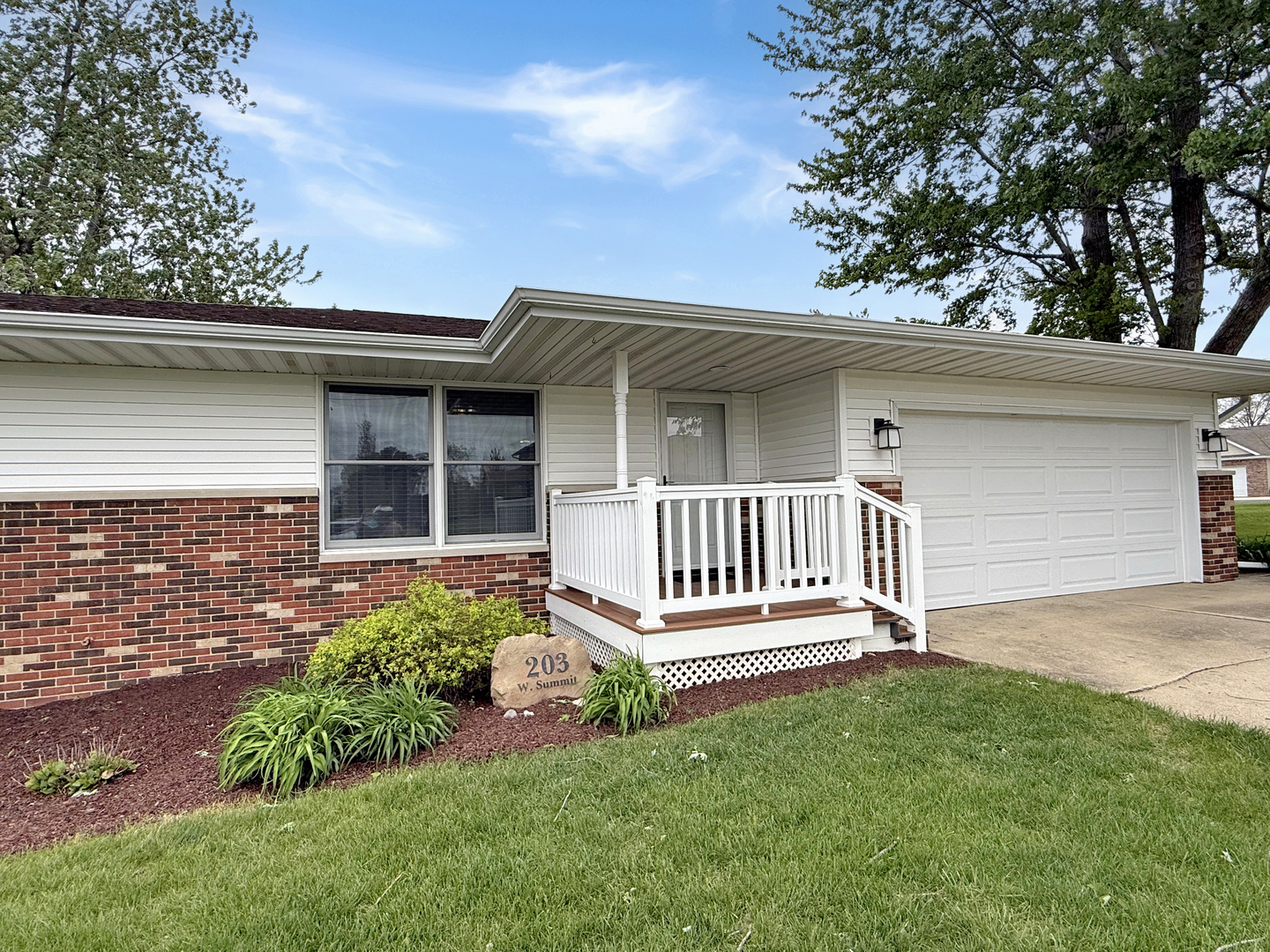 203 West Summit Street Gifford, IL 61847 - Photo 2 of 22 a view of a house with a small yard and a large tree front of it