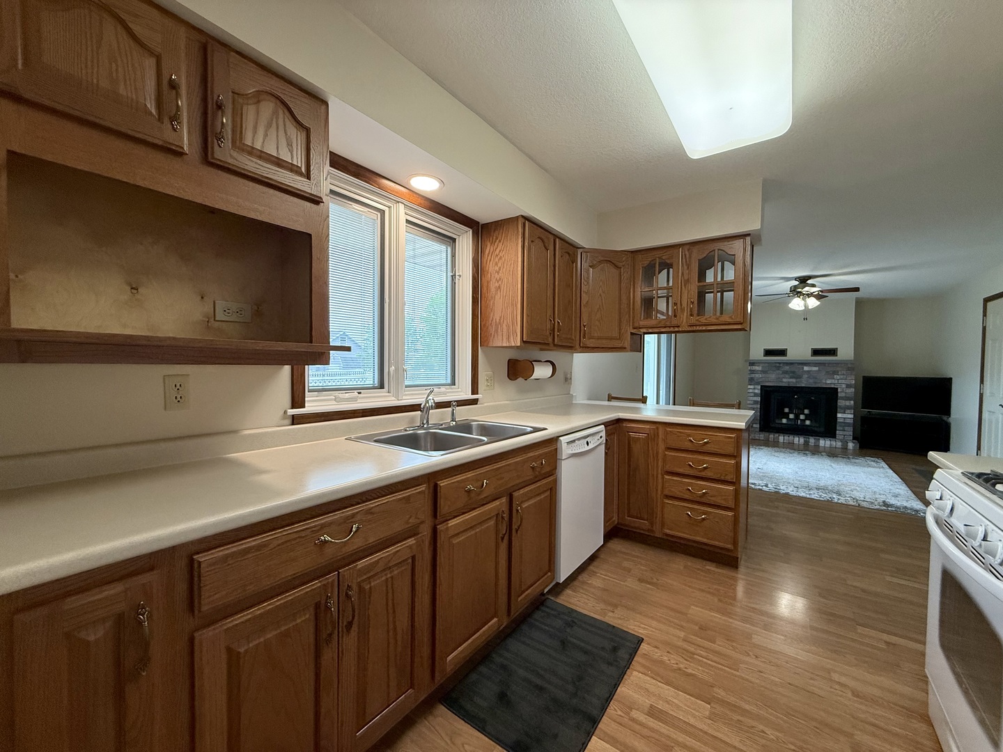 203 West Summit Street Gifford, IL 61847 - Photo 6 of 22 a kitchen with stainless steel appliances sink stove microwave and cabinets