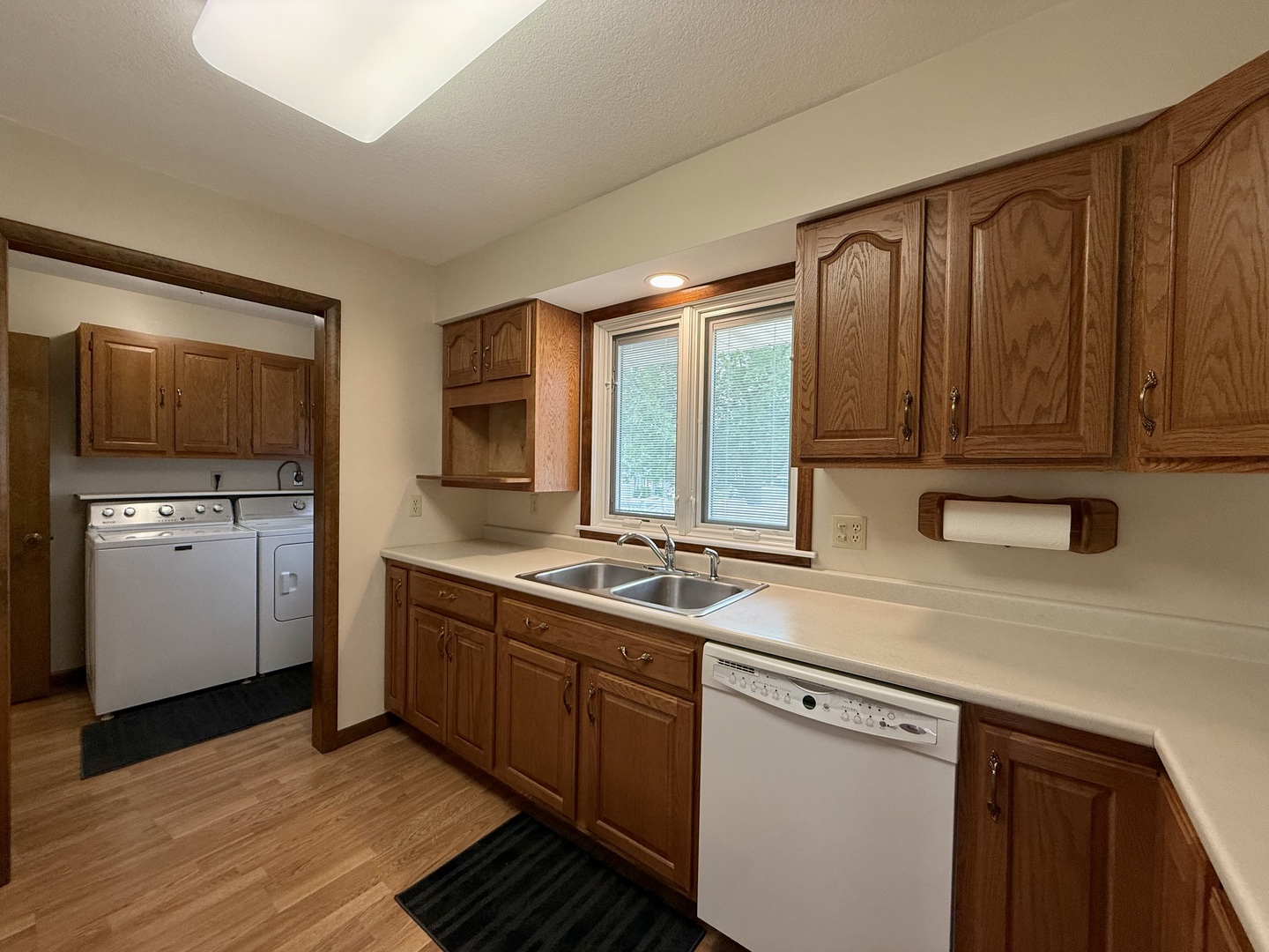203 West Summit Street Gifford, IL 61847 - Photo 7 of 22 a kitchen with stainless steel appliances granite countertop a sink stove and refrigerator