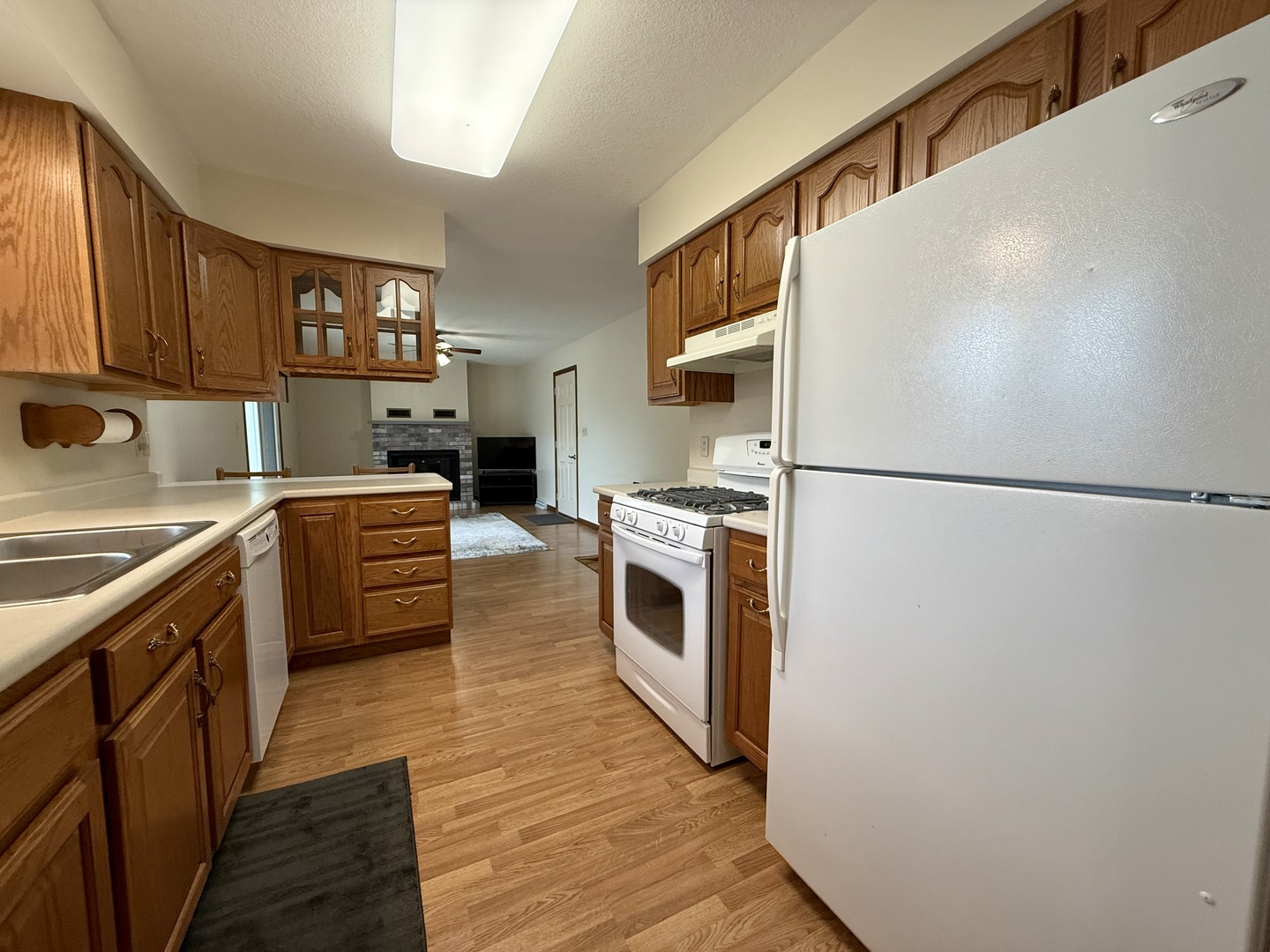 203 West Summit Street Gifford, IL 61847 - Photo 9 of 22 a kitchen with stainless steel appliances a refrigerator a sink a stove top oven a counter space and cabinets