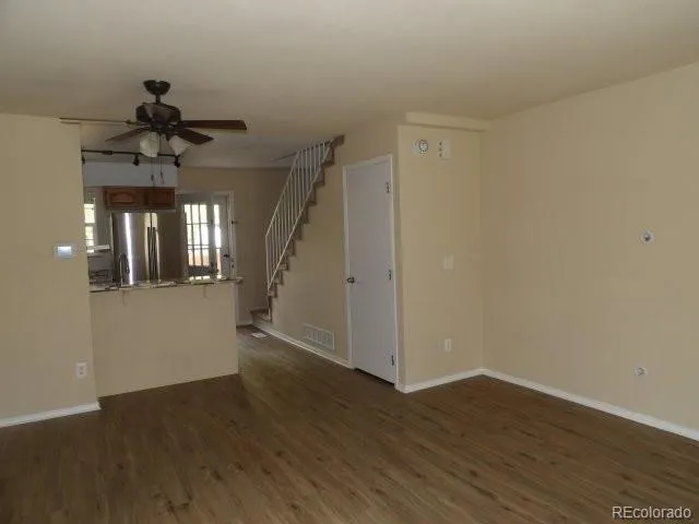 a view of an entryway with wooden floor