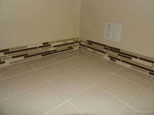 a room with gym equipment and view of living room