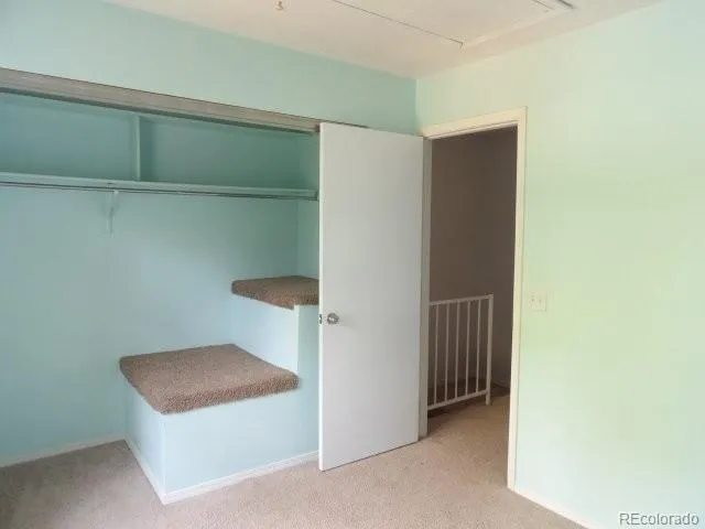 a room with a bench and cabinets
