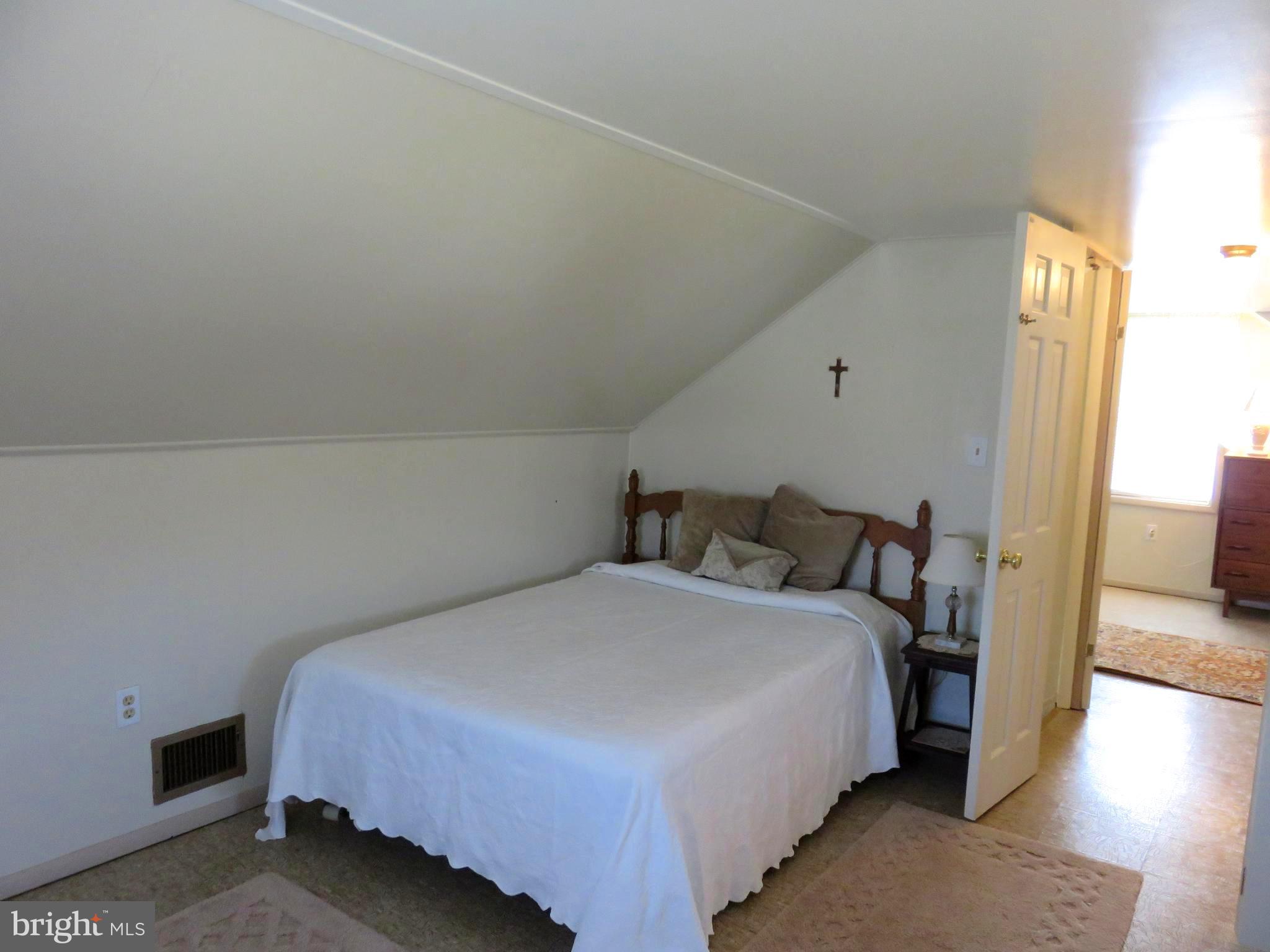 1710 Orlando Road Baltimore, MD 21234 - Photo 15 of 32 a bedroom with a bed and a large window
