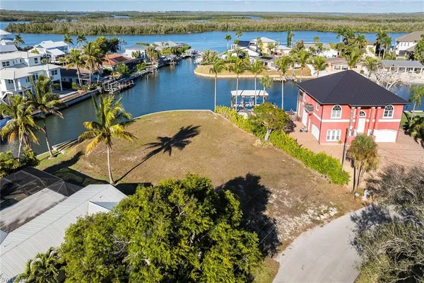 an aerial view of a house with a lake view