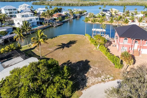 an aerial view of a house with a lake view