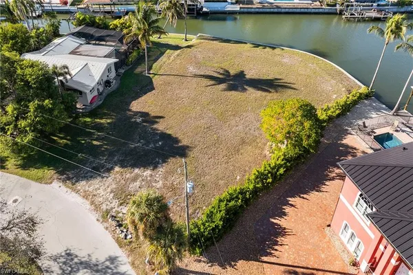 an aerial view of a house with a lake view