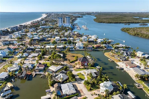 an aerial view of a house with a lake view