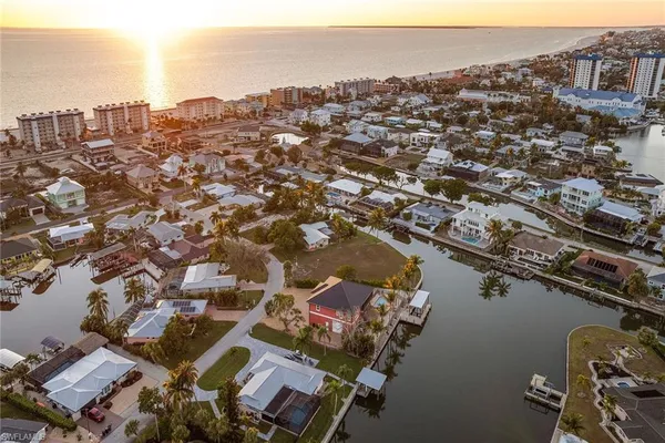 an aerial view of a house with a lake view