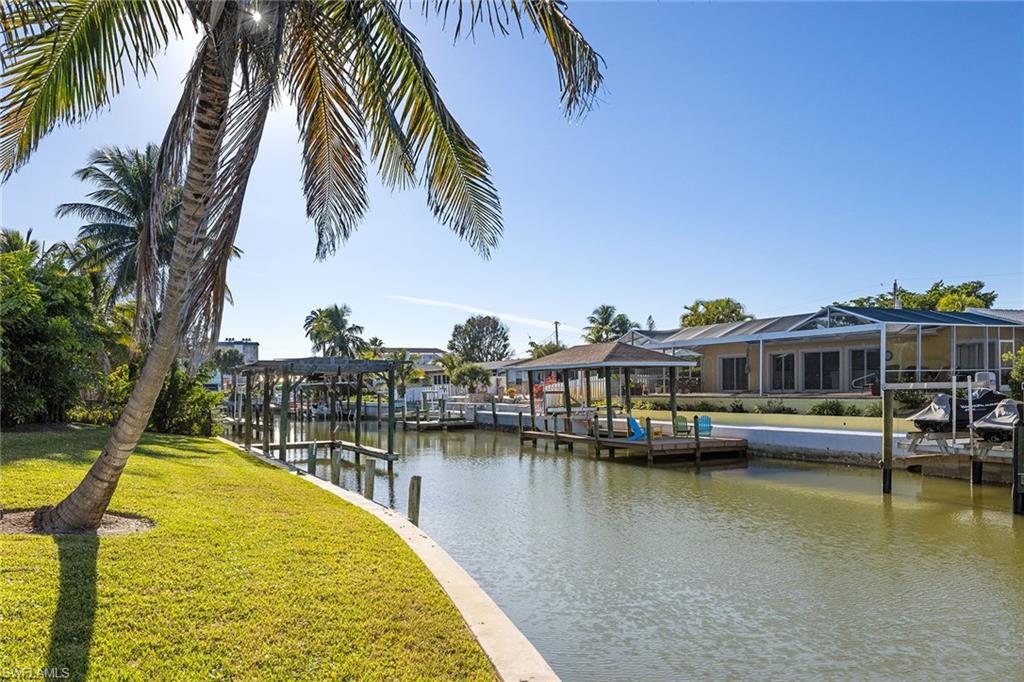 271 Randy Lane Fort Myers Beach, FL 33931 - Photo 6 of 38 a view of a swimming pool with a table and chairs