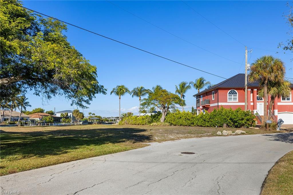 271 Randy Lane Fort Myers Beach, FL 33931 - Photo 7 of 38 a front view of a house with garden