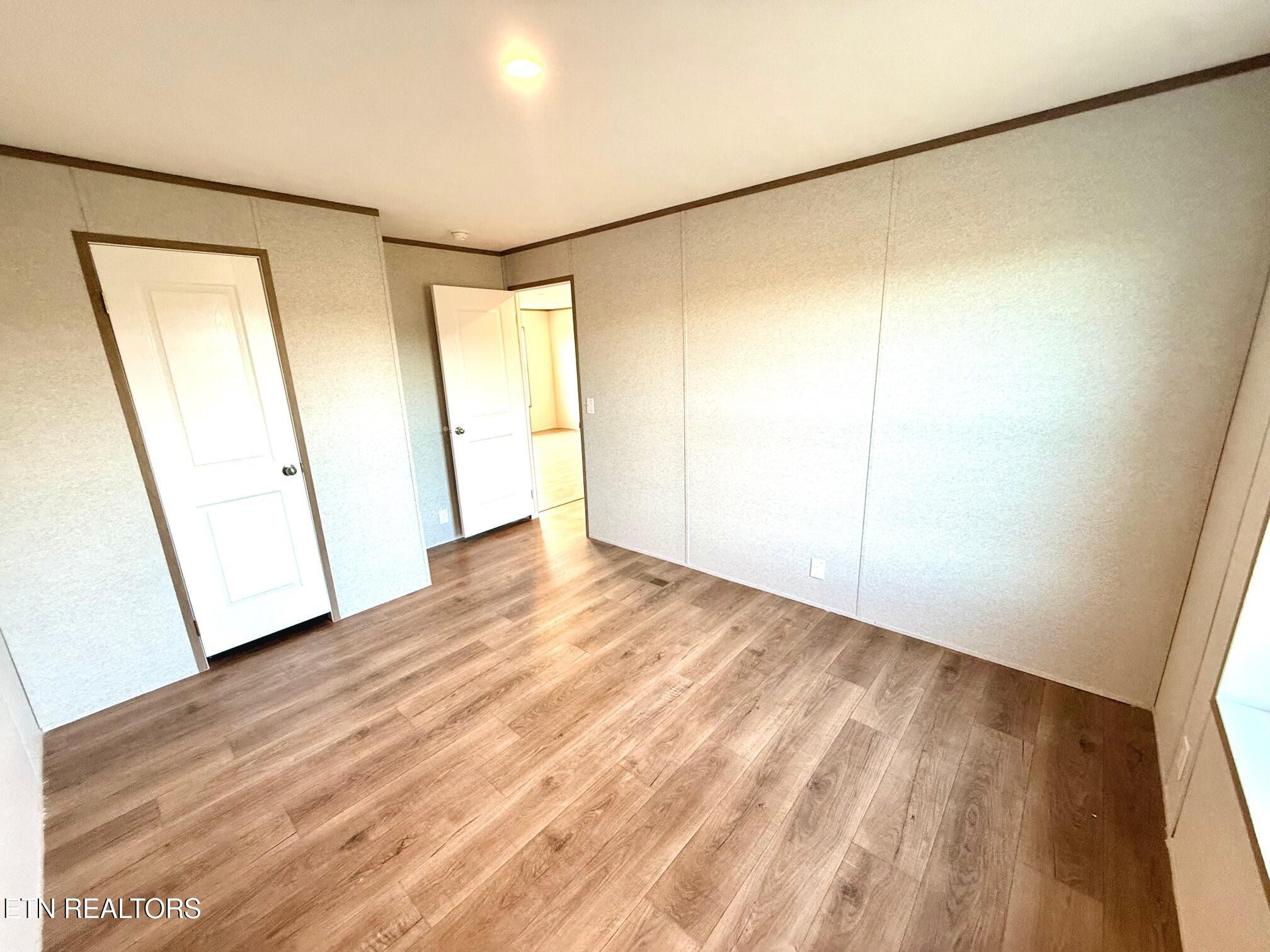 1478 Howell River Road Rutledge, TN 37861 - Photo 13 of 16 a view of empty room with wooden floor