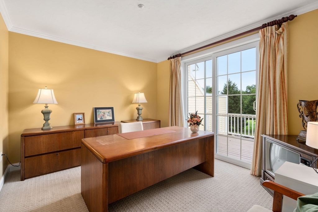 7 English Cmns, Unit 7 Topsfield, MA 01983 - Photo 15 of 36 a living room with a bed furniture and a window