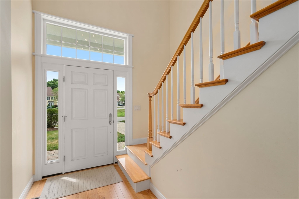 7 English Cmns, Unit 7 Topsfield, MA 01983 - Photo 17 of 36 a view of entryway with wooden floor and stairs