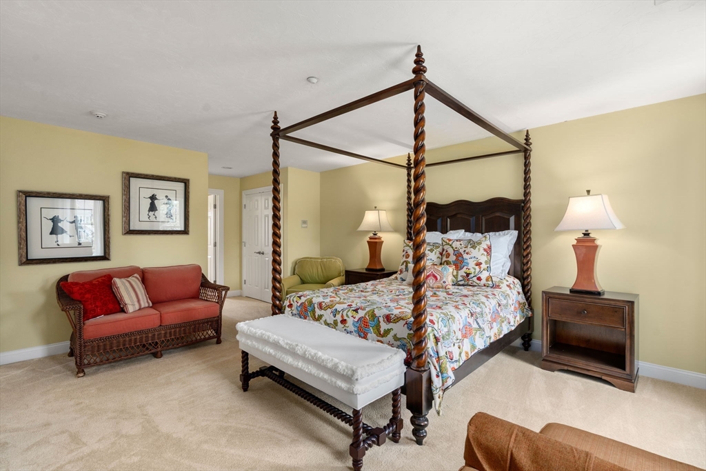 7 English Cmns, Unit 7 Topsfield, MA 01983 - Photo 21 of 36 a bedroom with a bed couch and window