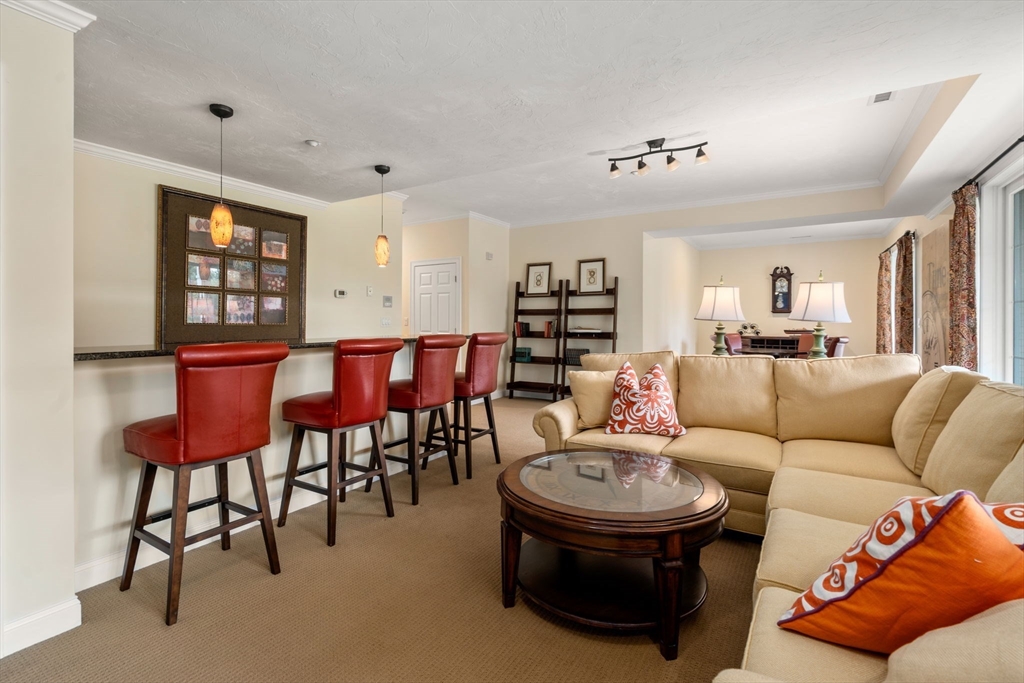 7 English Cmns, Unit 7 Topsfield, MA 01983 - Photo 25 of 36 a living room with furniture and wooden floor