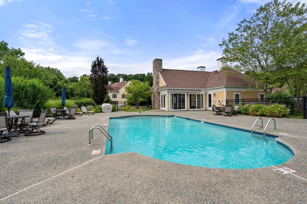 7 English Cmns, Unit 7 Topsfield, MA 01983 - Photo 35 of 36 a view of a house with swimming pool and sitting area