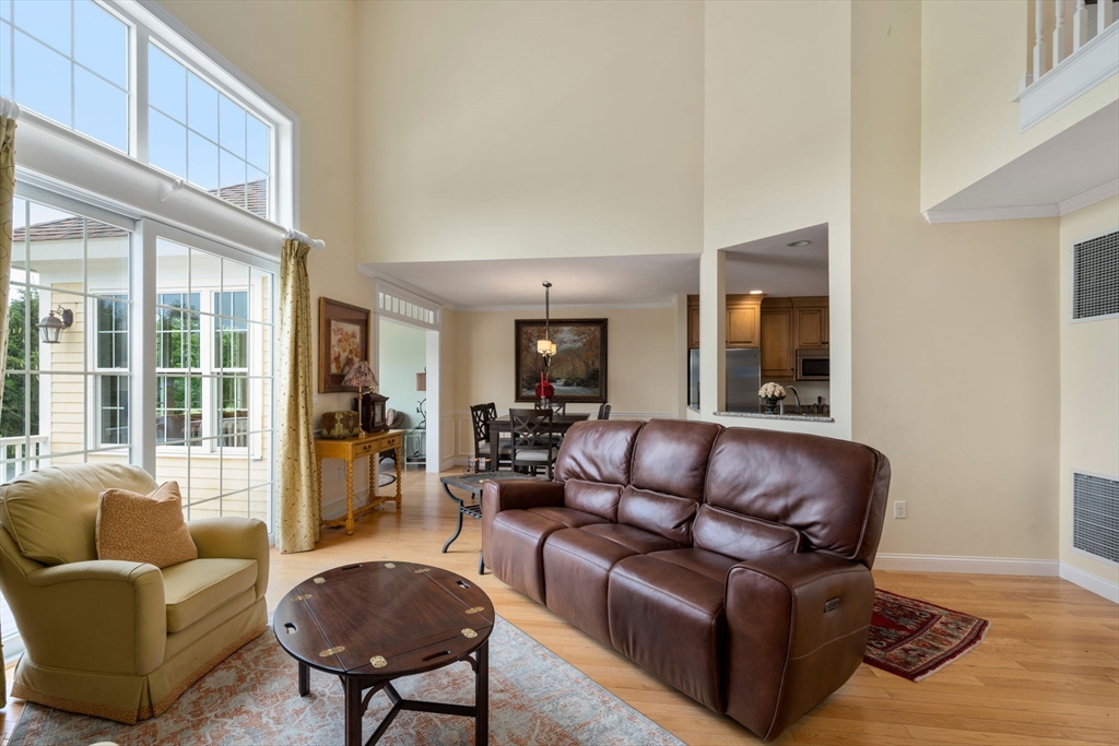 7 English Cmns, Unit 7 Topsfield, MA 01983 - Photo 6 of 36 a living room with furniture and a large window