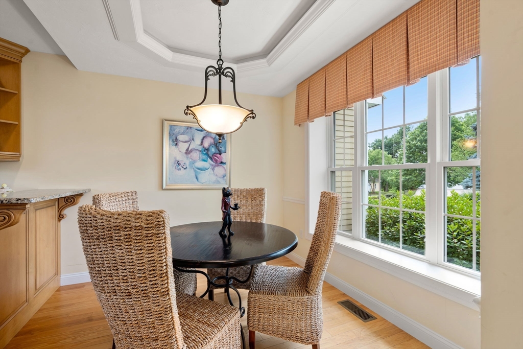 7 English Cmns, Unit 7 Topsfield, MA 01983 - Photo 9 of 36 a view of a dining room with furniture window and outside view