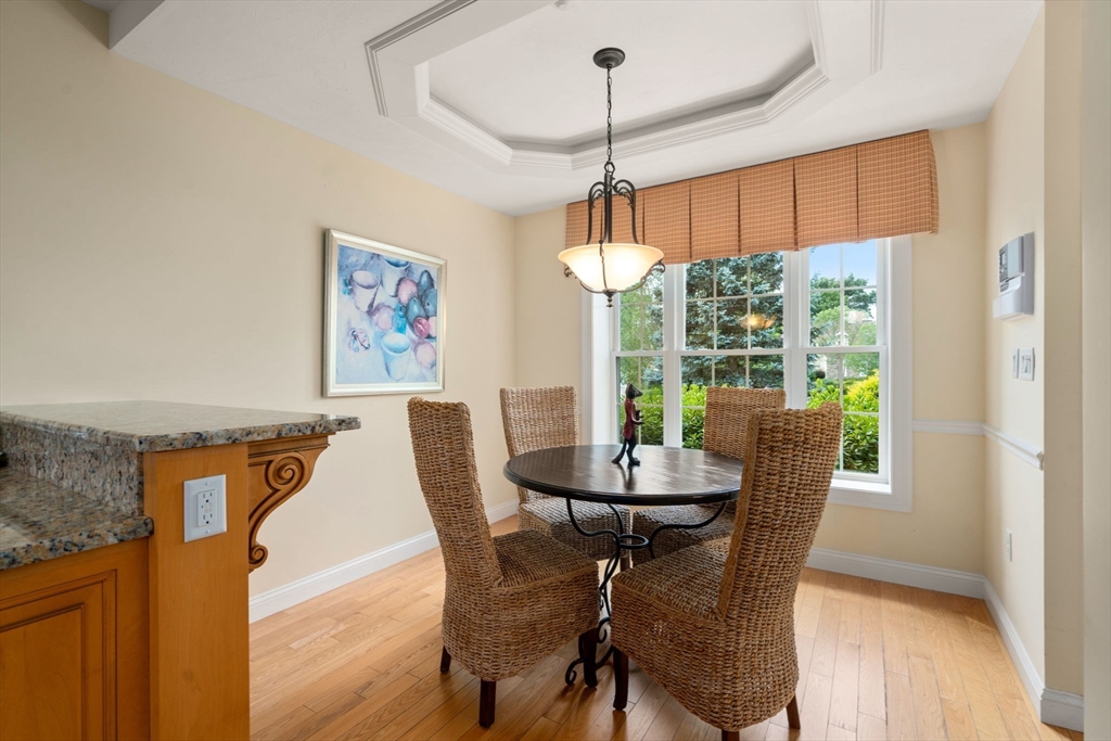 7 English Cmns, Unit 7 Topsfield, MA 01983 - Photo 10 of 36 a view of a dining room with furniture window and wooden floor