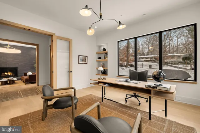 a view of entryway and hall with a front door