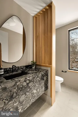 a living room with furniture large window and flat screen tv