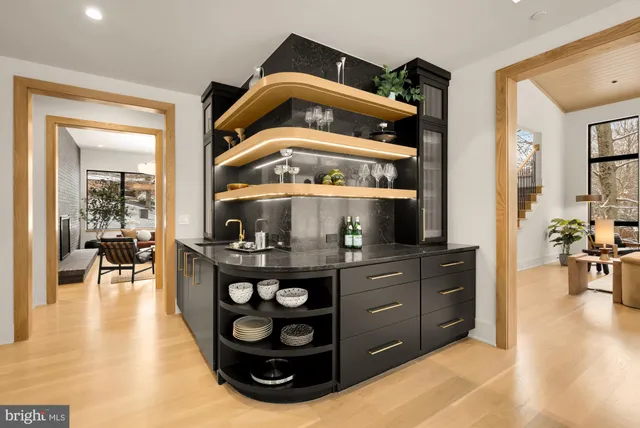 a kitchen with stainless steel appliances granite countertop cabinets and a stove top oven