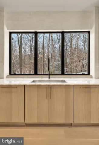 a bathroom with a shower and a glass door