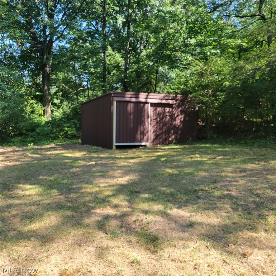 1500 Warner Road Southeast Canton, OH 44707 - Photo 19 of 21 View of yard featuring a storage shed