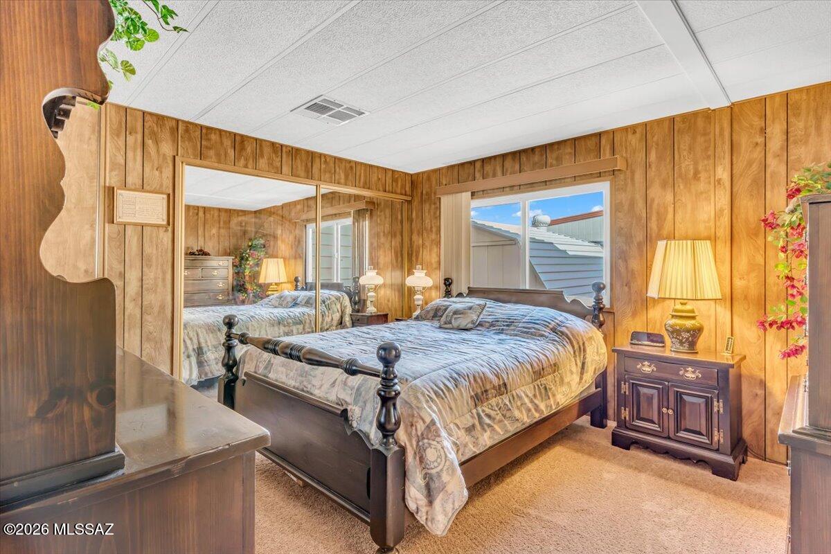 5840 West Flying W Street Tucson, AZ 85713 - Photo 16 of 38 a bed sitting in a spacious bedroom next to a window