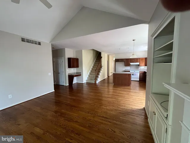 a view of kitchen and dining room with wooden floor