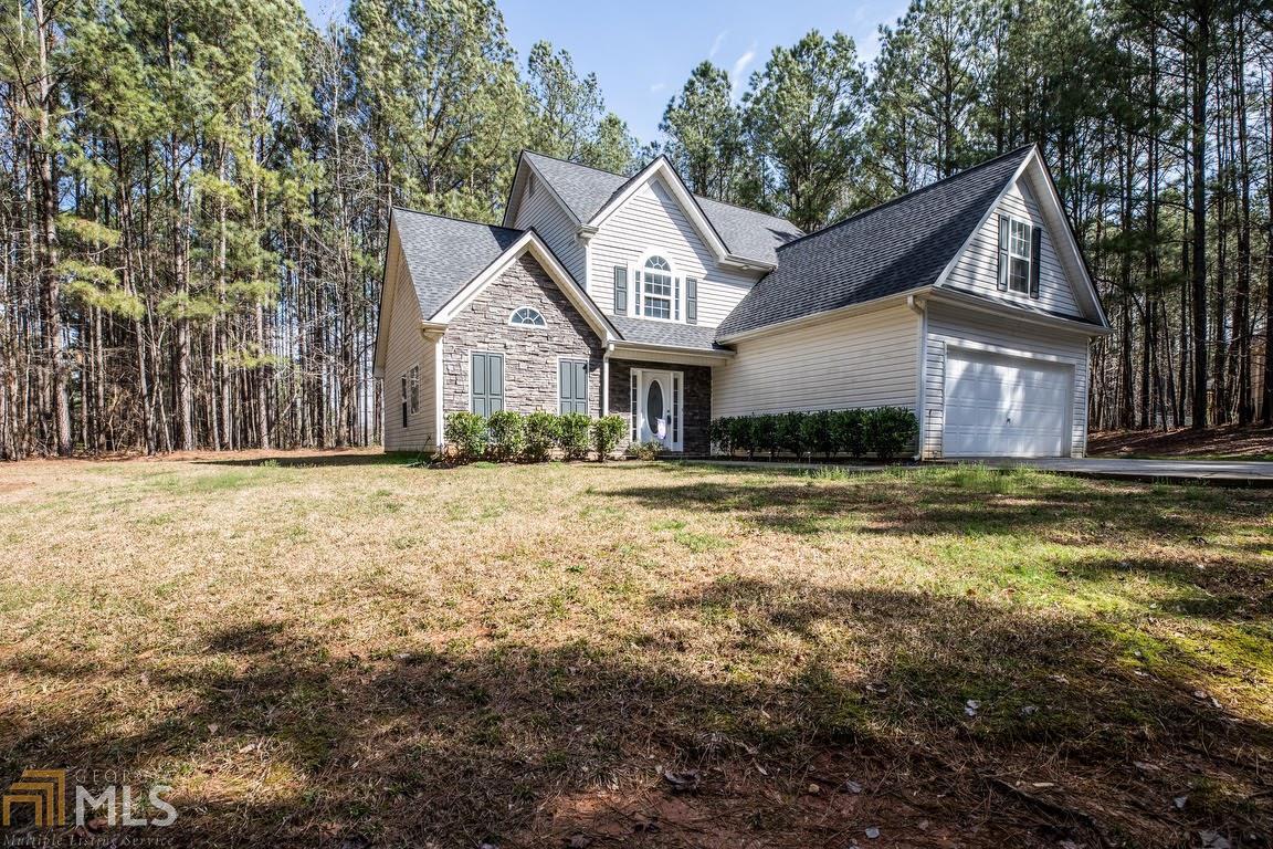 764 Legion Lake Road Villa Rica, GA 30180 - Photo 1 of 1 a front view of a house with a yard