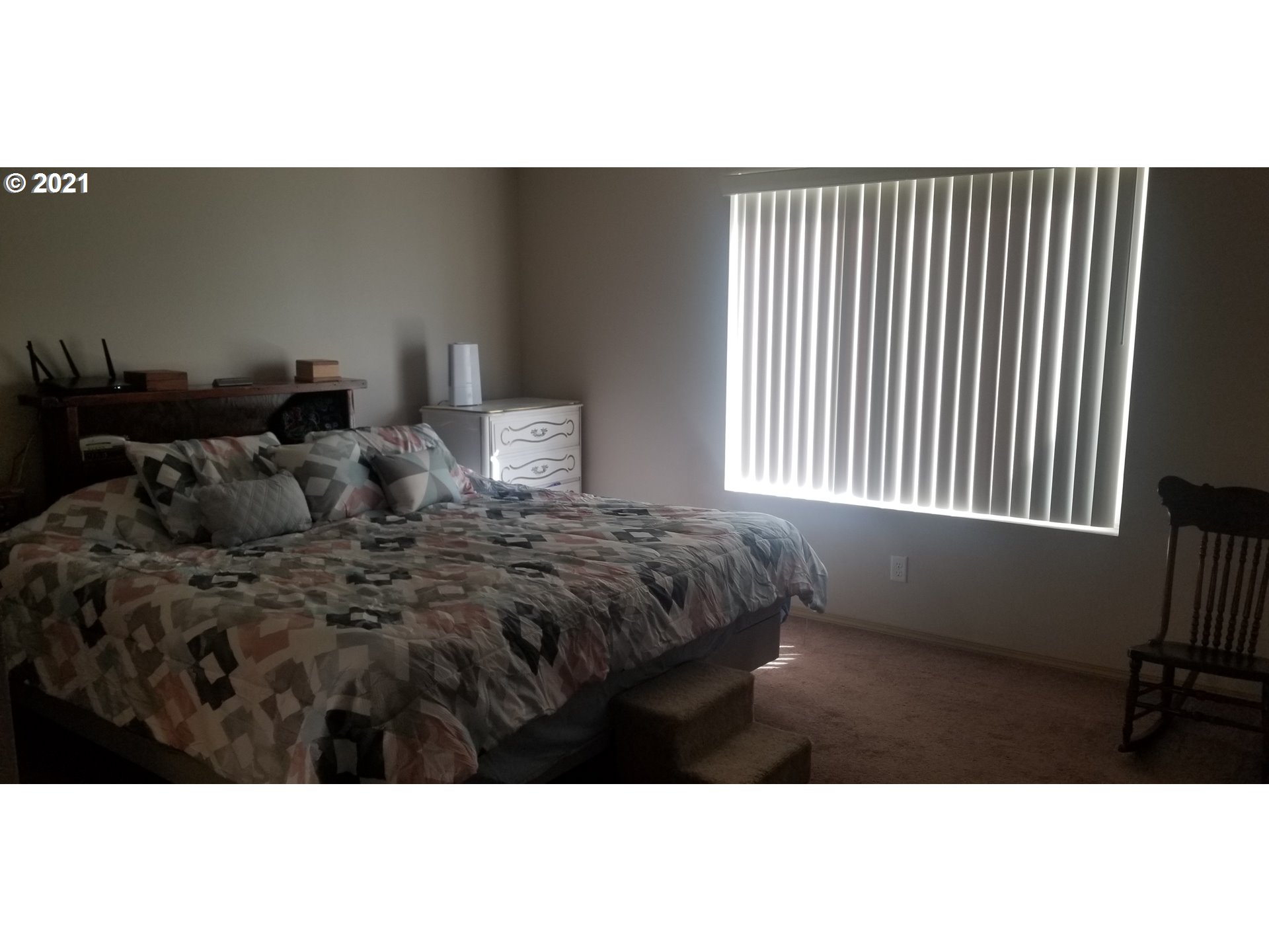 335 Southeast 3rd Street Irrigon, OR 97844 - Photo 15 of 29 a bedroom with a bed and a window