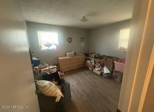 a bed room with furniture and a window