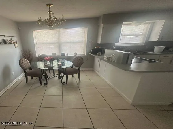 a view of a dining room with furniture